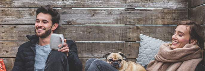 man and woman in a wood cabin