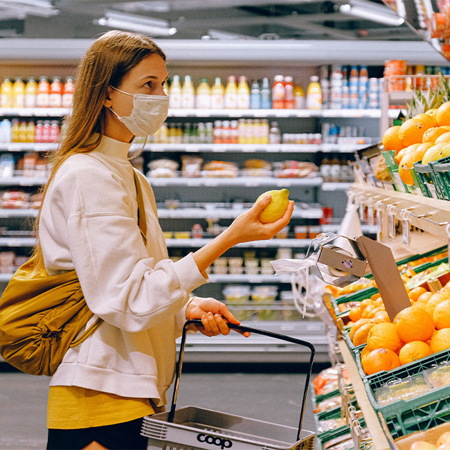 woman shopping wearing a mask